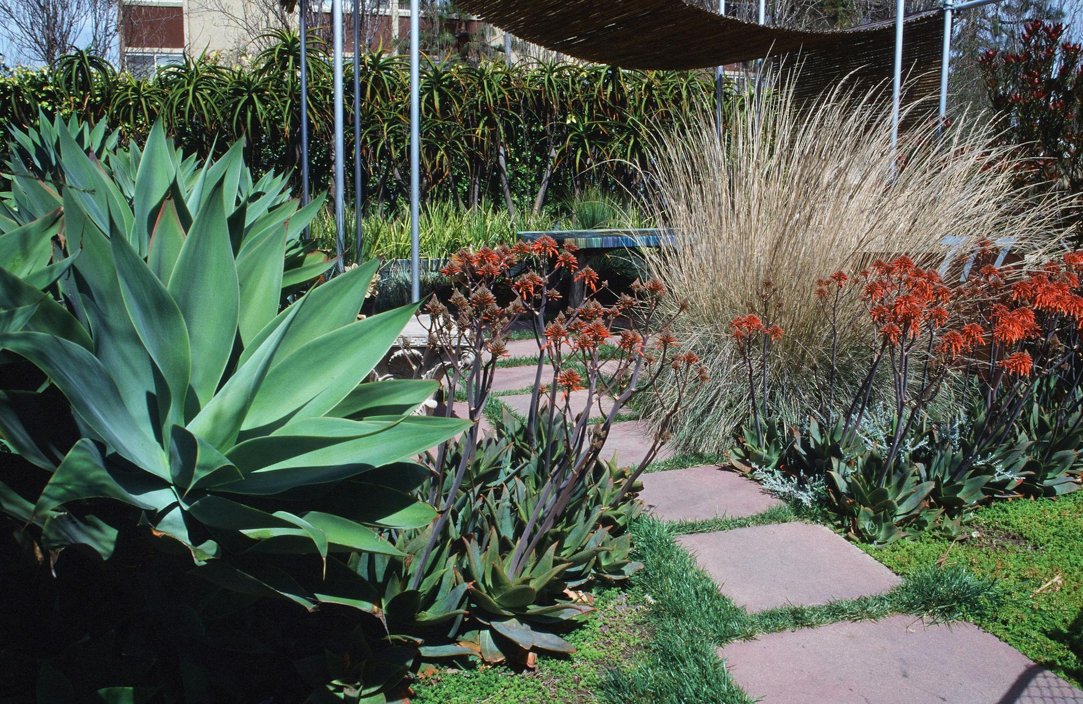 Precast steppers can be used to create convenient connections within a landscape for minimal cost. (Maureen Gilmer/MCT) ORG XMIT: 1147296