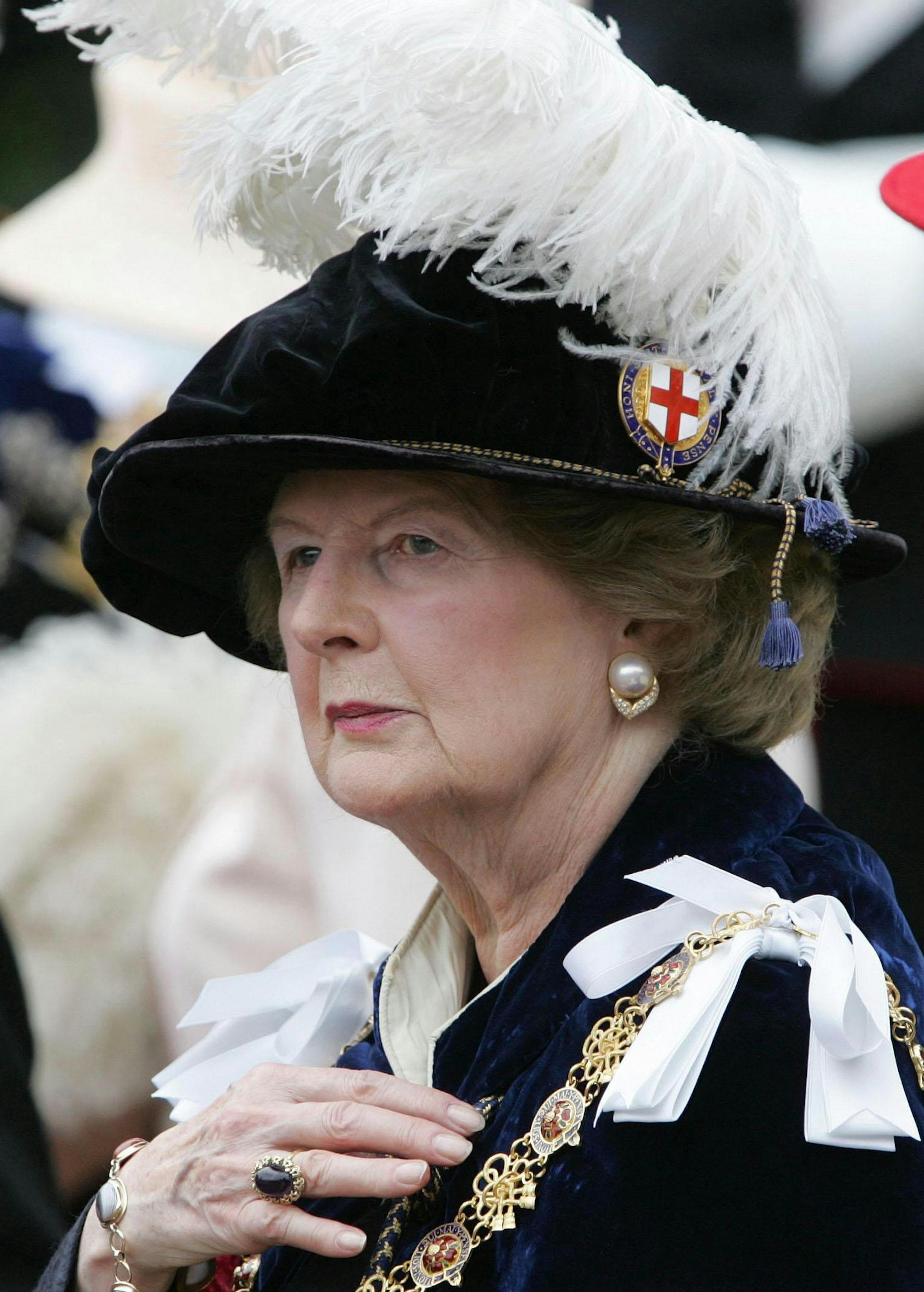 FILE - In this June 19, 2006 file photo, former British Prime Minister Margaret Thatcher, a member of the Order of the Garter, leaves St. George's Chapel in Windsor, near London, after attending the annual Garter Service where the younger sons of Queen Elizabeth, the Duke of York and the Earl of Wessex, were formally admitted to the order. Thatcher's former spokesman, Tim Bell, said the former prime minister, known to both friends and foes as "The Iron Lady," died of a stroke Monday morning, Apr