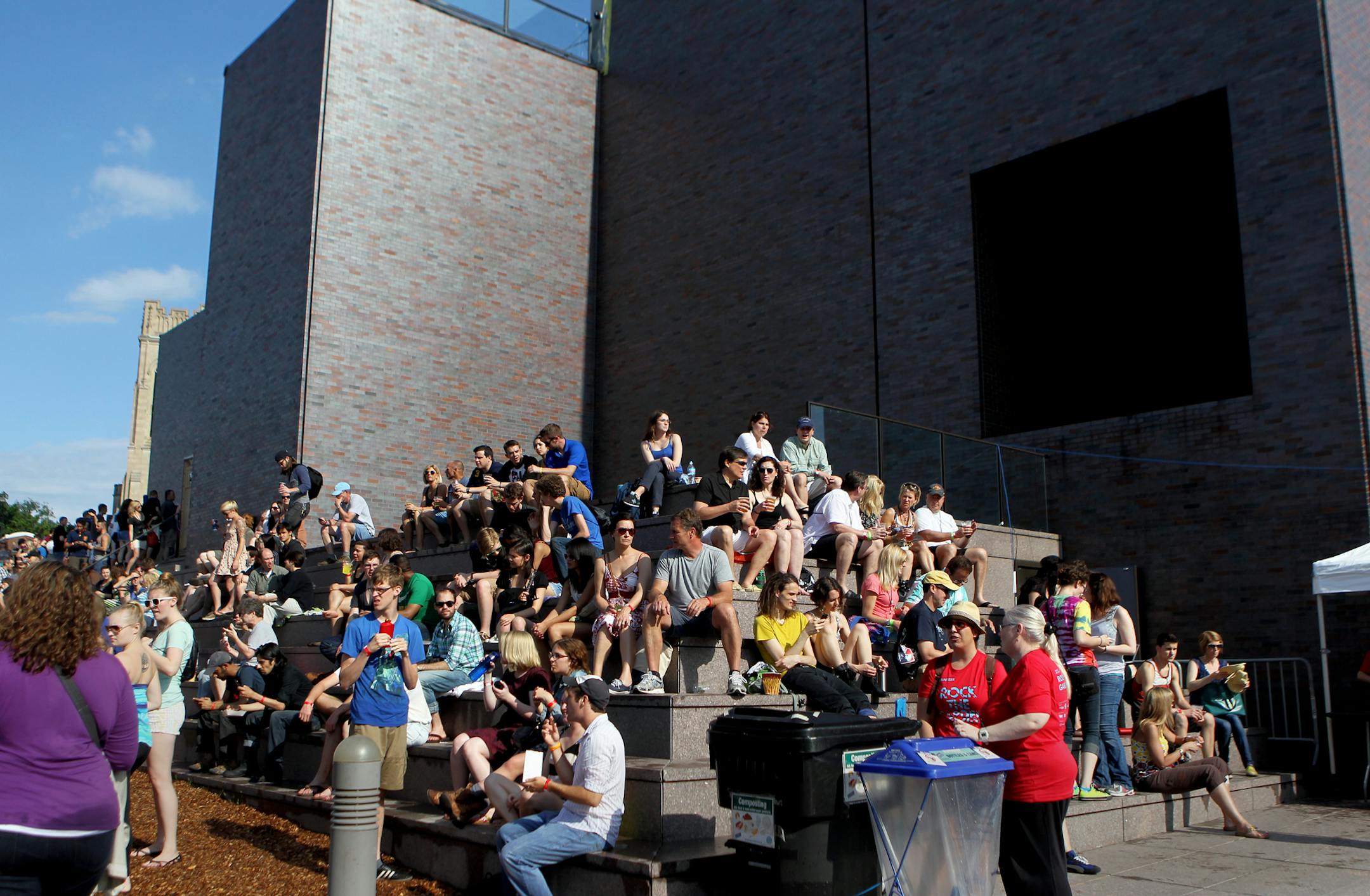 Concert-goers sit on the steps of the Walker Arts Center at the Rock the Garden concert at the Walker Art Center/Minneapolis Sculpture Garden on Saturday, June 15, 2013. The event featured Dan Deacon, Low, Bob Mould Band, Silversun Pickups and headliner Metric. ] (ANNA REED/STAR TRIBUNE) anna.reed@startribune.com (cq)