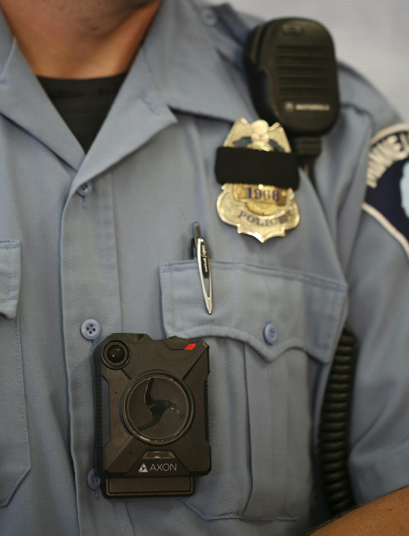 Minneapolis Police Officer Ken Feucht was one of the officers who volunteered for the body camera pilot program. He wore the Axon camera, made by Taser that will be used by the Minneapolis Police Department at the news conference at the First Precinct Police Headquarters Tuesday afternoon. ] JEFF WHEELER &#xef; jeff.wheeler@startribune.com Mayor Betsy Hodges and Police Chief Jane Harteau announced at a news conference Tuesday afternoon, July 19, 2016 that Minneapolis Police Department's Body Cam