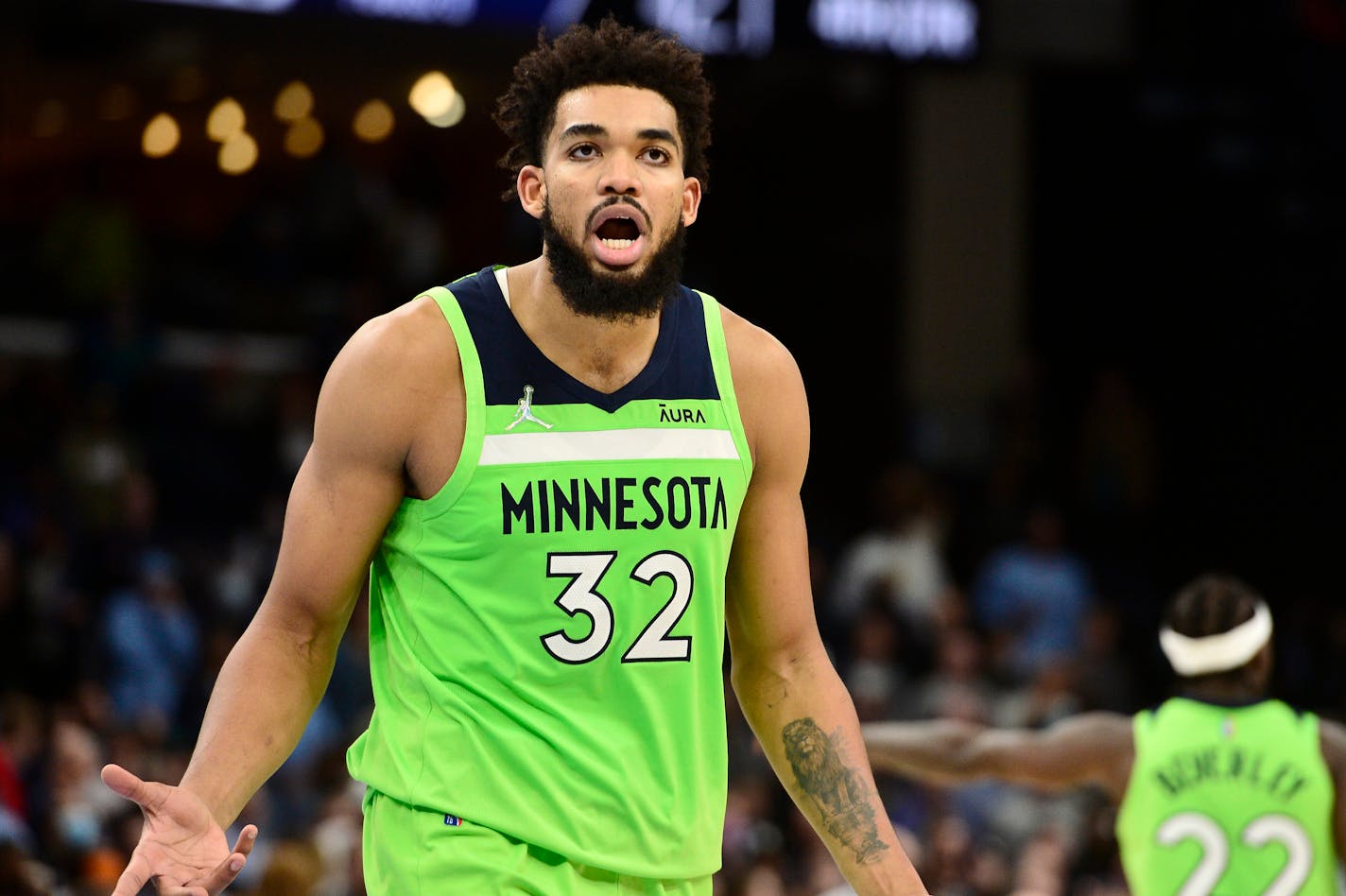 Minnesota Timberwolves center Karl-Anthony Towns (32) reacts in the second half of an NBA basketball game against the Memphis Grizzlies, Monday, Nov. 8, 2021, in Memphis, Tenn. (AP Photo/Brandon Dill)