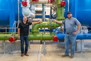 Ryan Capelle, left, a project manager with Stantec and lead engineer on construction of the plant, and Jon Stueve, public works director for Cold Spri