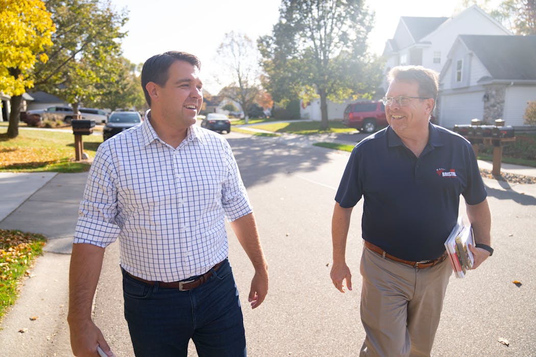 GOP state auditor candidate Ryan Wilson, left, and state representative candidate John Bristol door-knocked Saturday, Oct. 22, in Maple Grove.