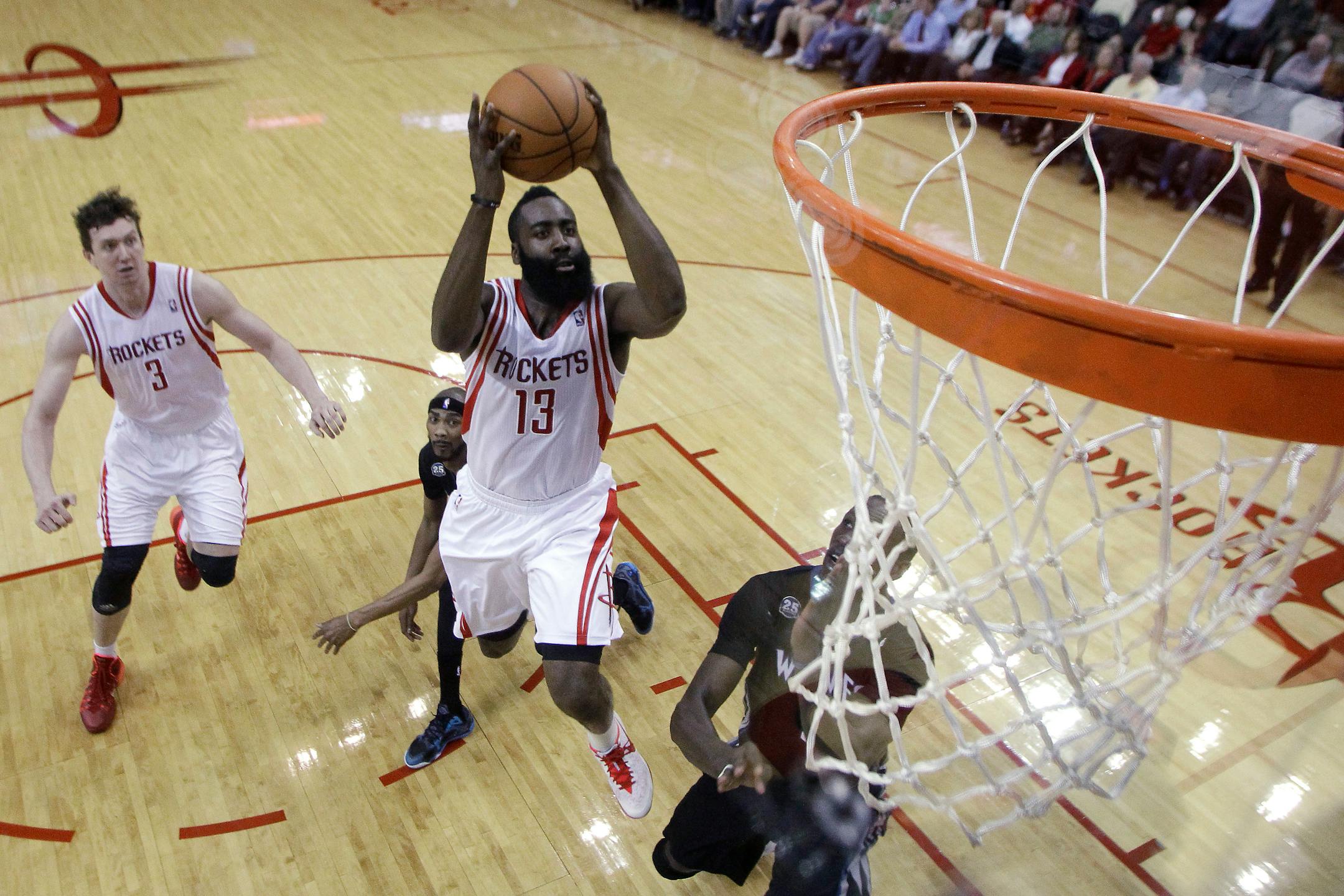 Houston Rockets guard James Harden takes a shot during the first half of an NBA basketball game against the Minnesota Timberwolves, Thursday, March 20, 2014, in Houston. The Rockets defeated the Timberwolves 129-106. (AP Photo/Patric Schneider)