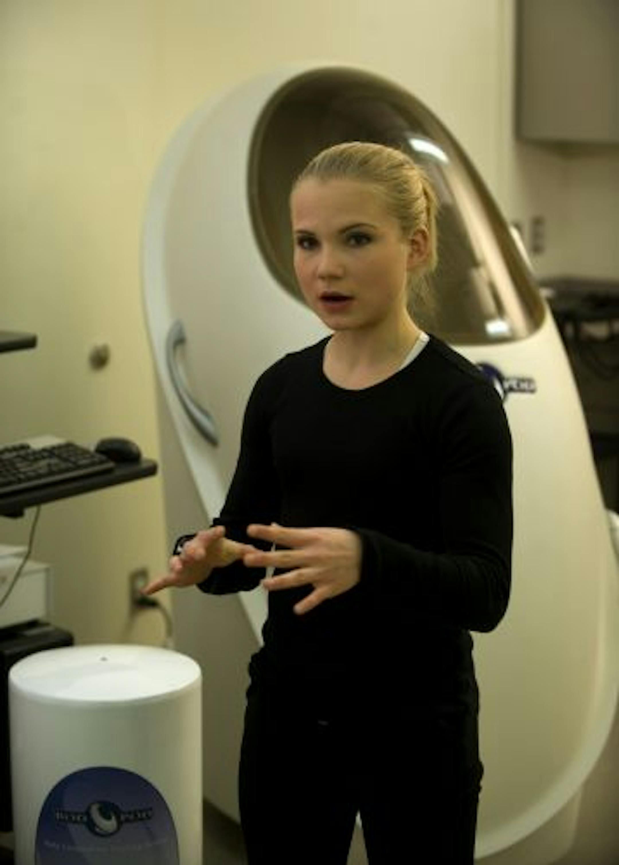 Sarah Mork explains the test proceedure during a demonstration of the Bod Pod.