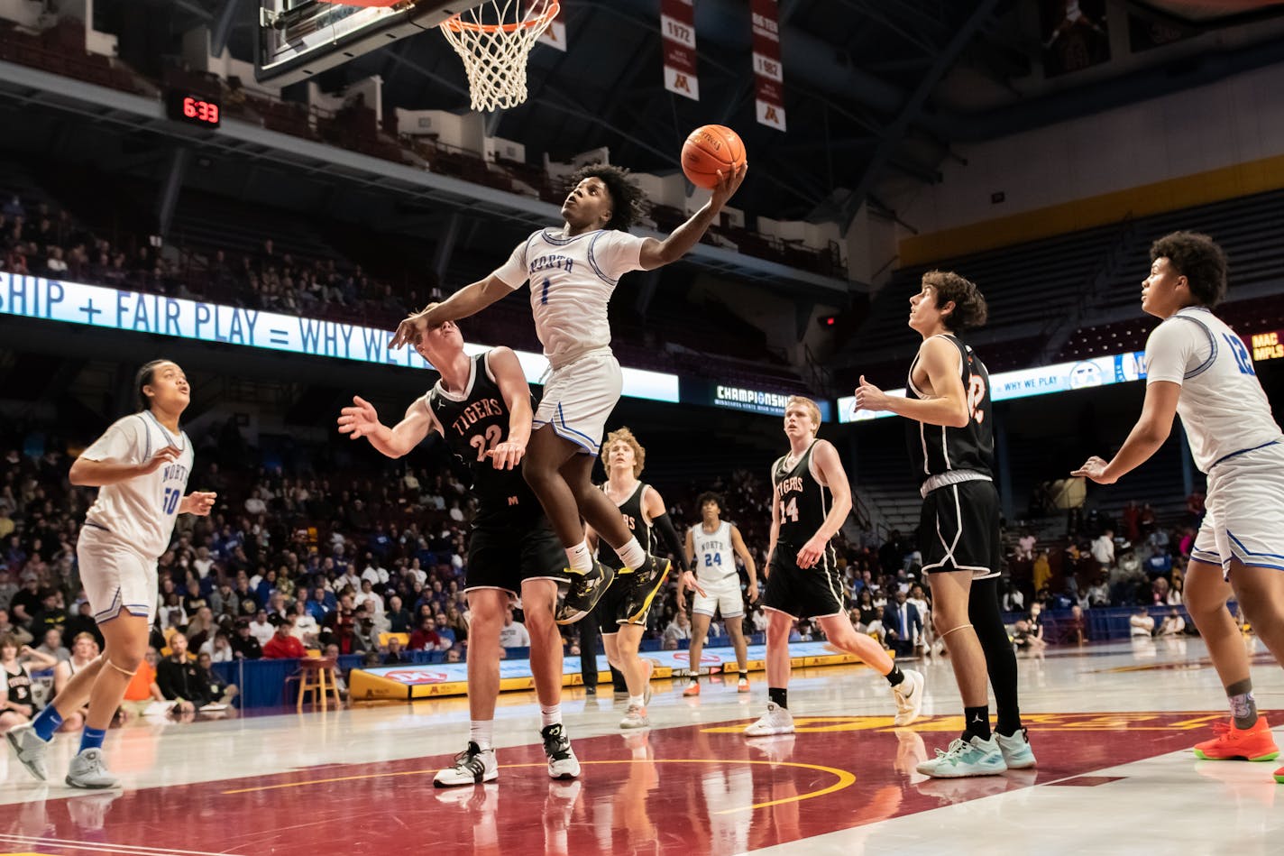 Minneapolis North's Mario Sanders gets the layup in the first half Friday night in the Class 2A semifinal game between Minneapolis North and Morris Area/Chokio-Alberta at Williams Arena. Minneapolis North gets the win, 71-63. Photo by Earl J. Ebensteiner, SportsEngine