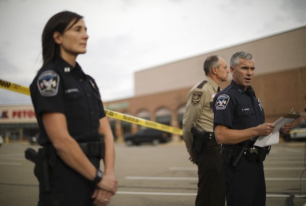 Burnsville Chief of Police Eric Gieseke, right, briefed reporters Monday afternoon about the shooting of two people inside a Dollar Tree in the Burnsv