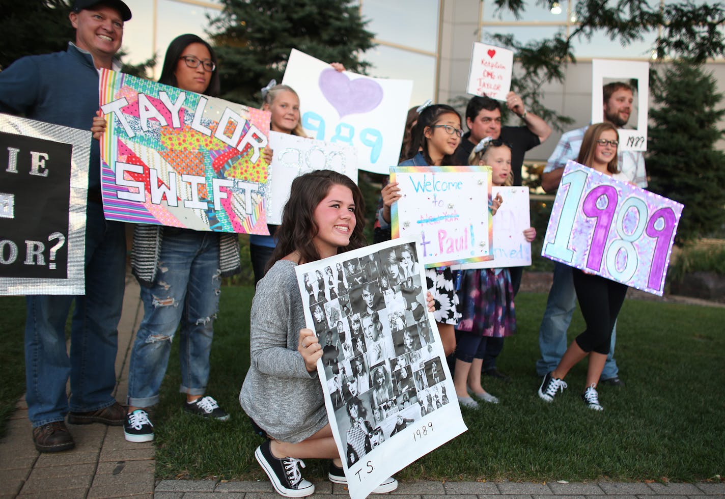 Mia Coperbinson, 15, of Virginia, posed with her neighbors and family who all drove down for the Taylor Swift concert at the Xcel Energy Center on Swift's second of three performances this weekend. ] (KYNDELL HARKNESS/STAR TRIBUNE) kyndell.harkness@startribune.com Taylor Swift concert at the Xcel Energy Center in St. Paul, Min., Saturday September 12, 2015.