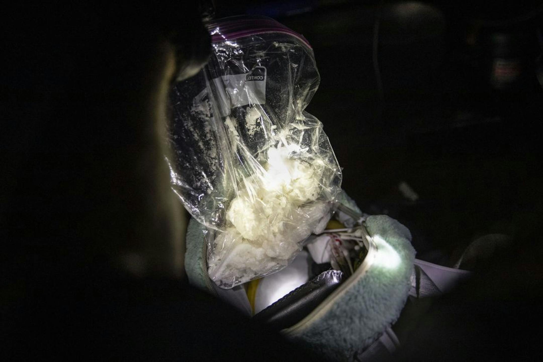 Sgt. Matt McShane from the Duluth Police Department pulled out nearly a pound of crystal meth from a small bag in the passenger seat of a pickup truck. Dayshift officers from the Duluth Police Department received intel early on Wednesday that a pickup truck matching this description and license plate would be transporting crystal meth later that night. Approximately a total of one pound of meth was found in the truck.