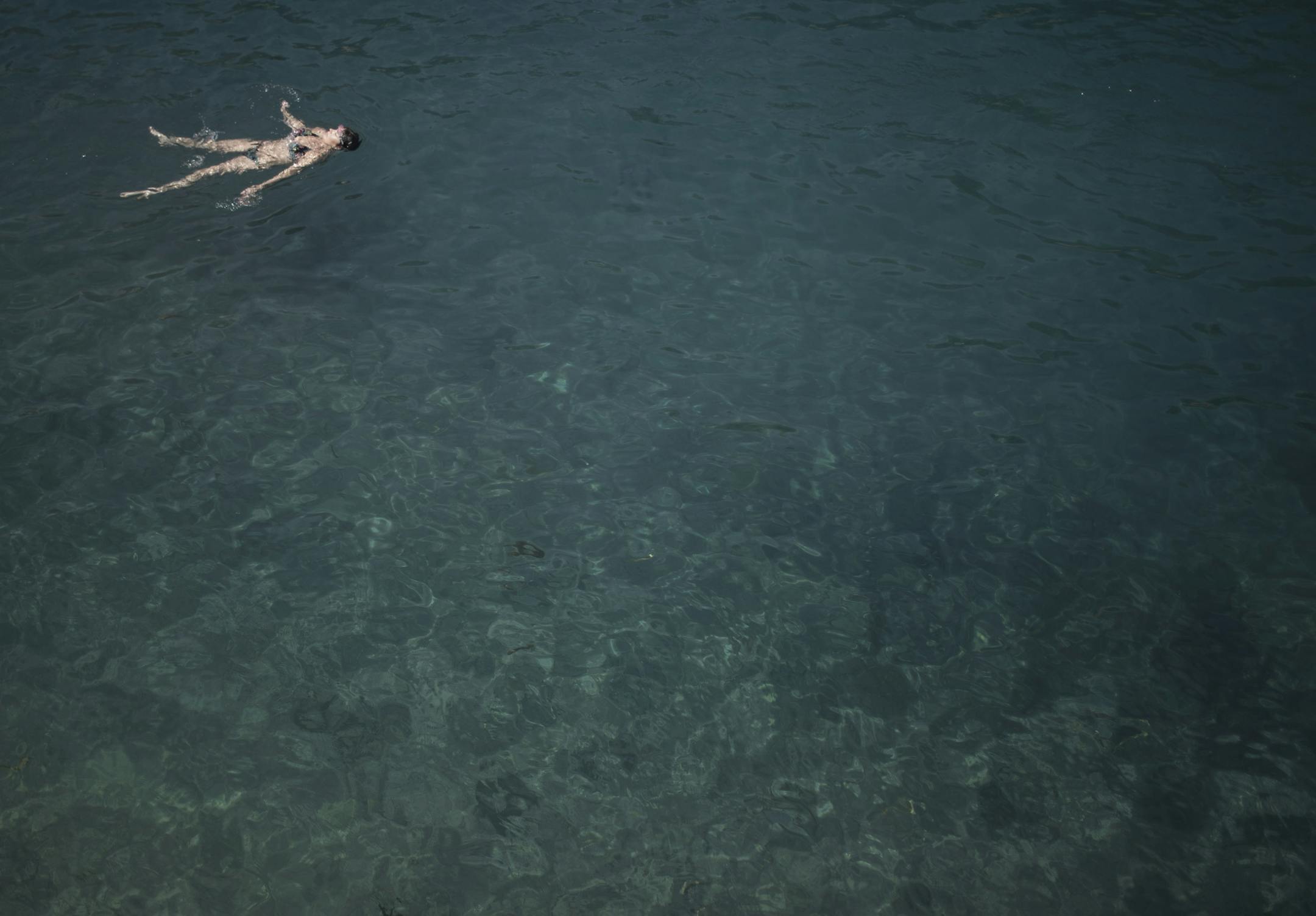 A woman, swimming at the Gan HaShlosha National Park, also known by its Arabic name Sahne, in northern Israel, April 18, 2015. With its part-Mediterranean, part-desert climate, Israel had suffered from water shortages for decades, but a national effort to desalinate Mediterranean seawater and to recycle wastewater has provided Israel with enough water for all its needs. (Uriel Sinai/The New York Times)