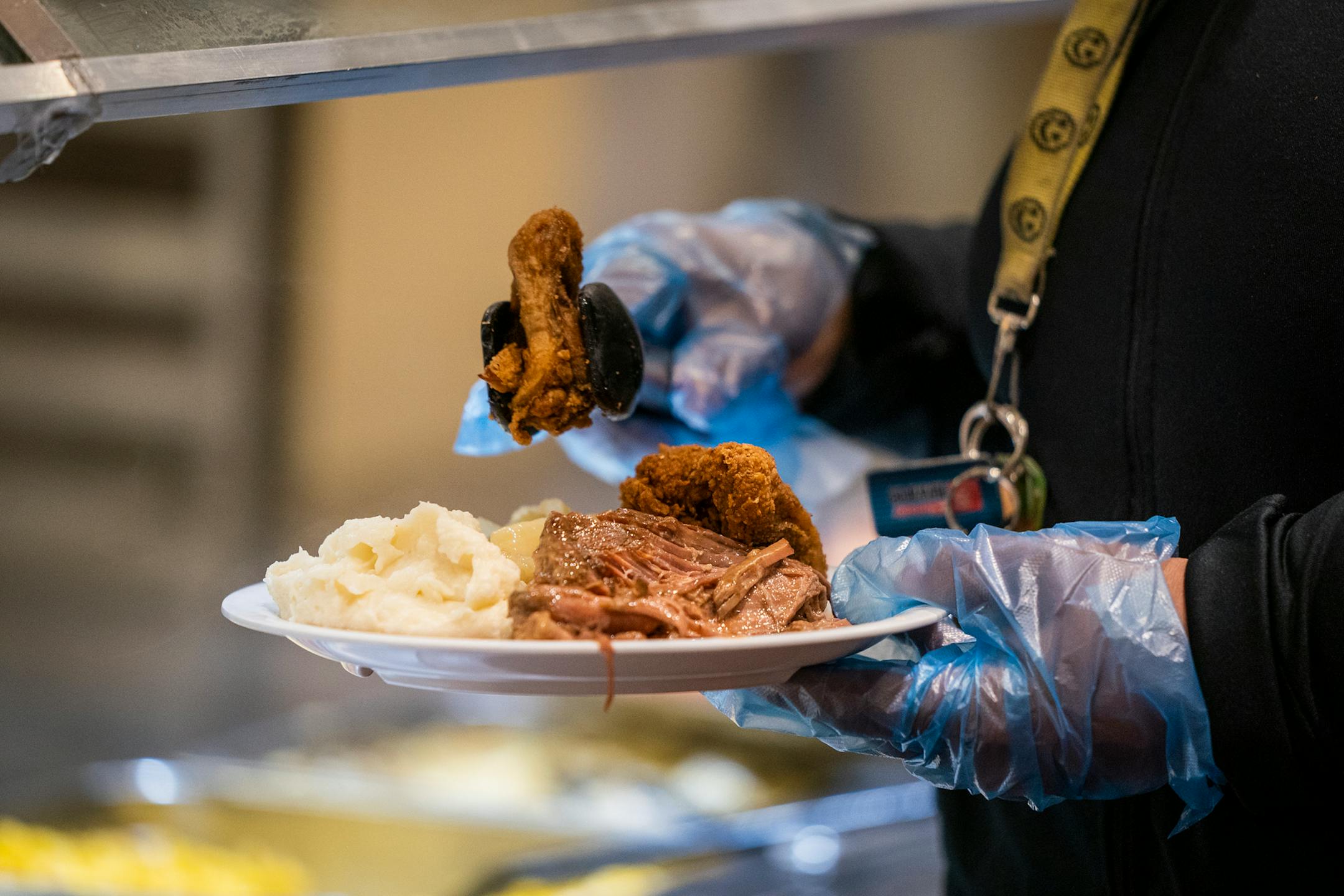 A customer used disposable gloves at the self-serve buffet area at the Golden Coral Buffet and Grill. ] LEILA NAVIDI • leila.navidi@startribune.com BACKGROUND INFORMATION: Golden Corral Buffet and Grill in Maple Grove on Friday, October 2, 2020.