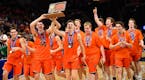 Delano players celebrated their 65-61 3A championship victory over Columbia Heights.