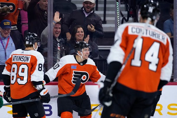 Former Minnetonka High School standout Bobby Brink (10) celebrates with Cam Atkinson (89) and Sean Couturier (14) after scoring his first NHL goal for