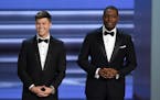 Hosts Colin Jost, left, and Michael Che speak at the 70th Primetime Emmy Awards on Monday, Sept. 17, 2018, at the Microsoft Theater in Los Angeles. (P