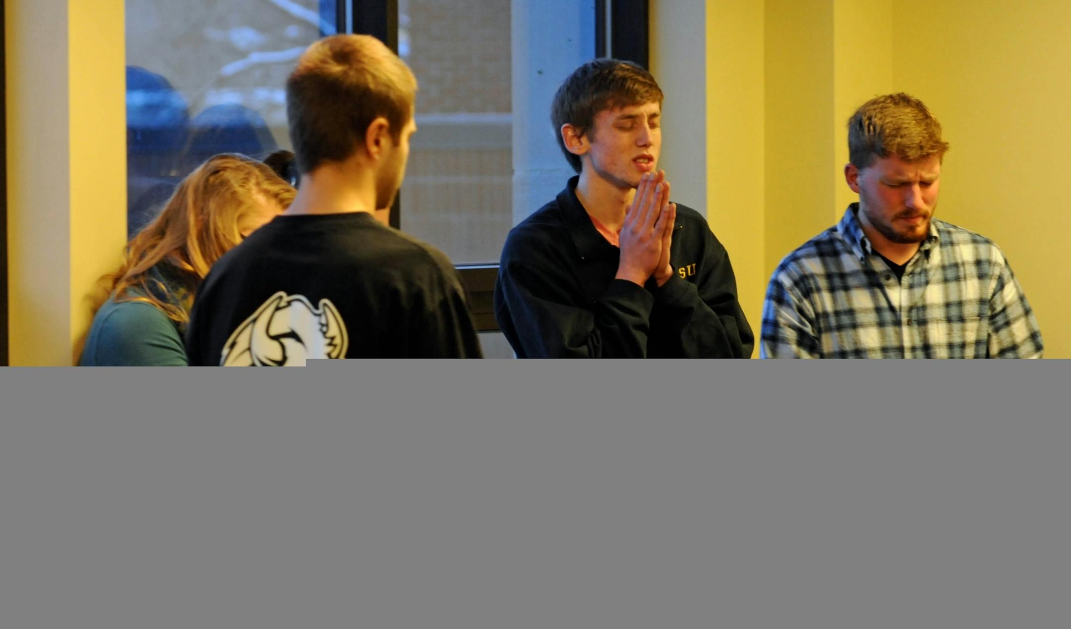 Students led a prayer session Wednesday morning at the North Dakota State University student union to pray for the families of four freshmen killed in a car accident Monday. The prayer was organized by the Chi Alpha Christian Fellowship, a student Christian group on campus..