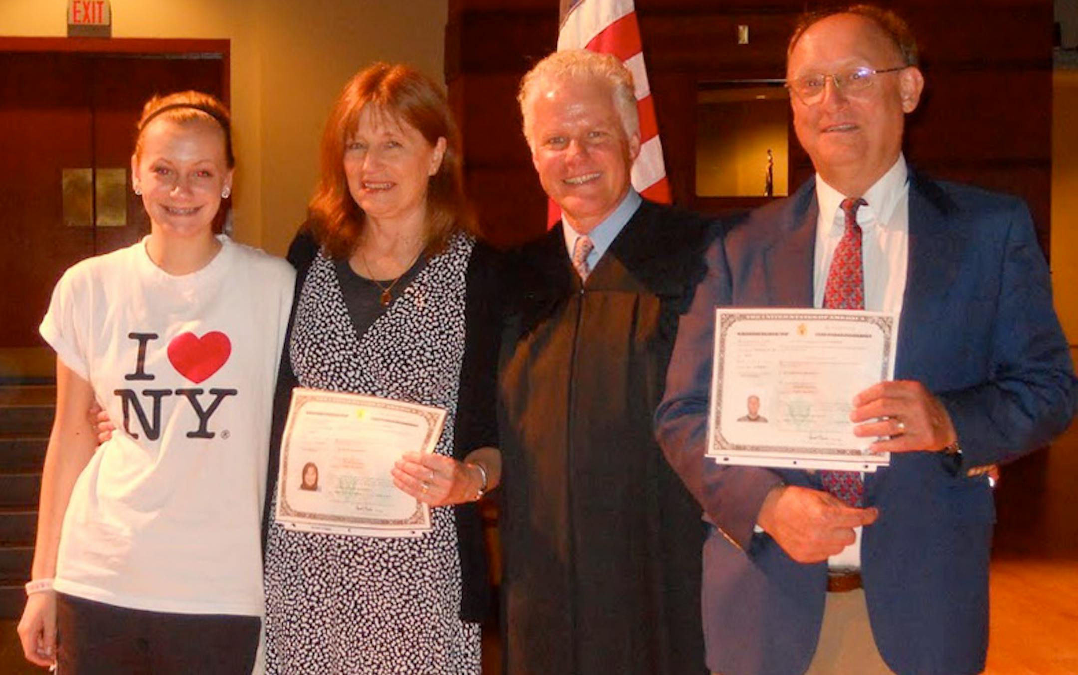 From left, Blanche Danecek, her mother, Blanka Danecek, the presiding judge, and Blanche's father, Andrew Danecek, at their June 1 citizenship ceremony at Bethel University in Arden Hills.