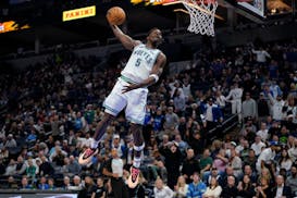Minnesota Timberwolves guard Anthony Edwards (5) goes up for a dunk during Wednesday's win.