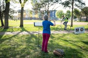 Flautist Julie Johnson played a 15 minute concert as part of the Bach Society of MinnesotaÕs Mobile Mini Concert Series at Van Cleve Park in Minneapo