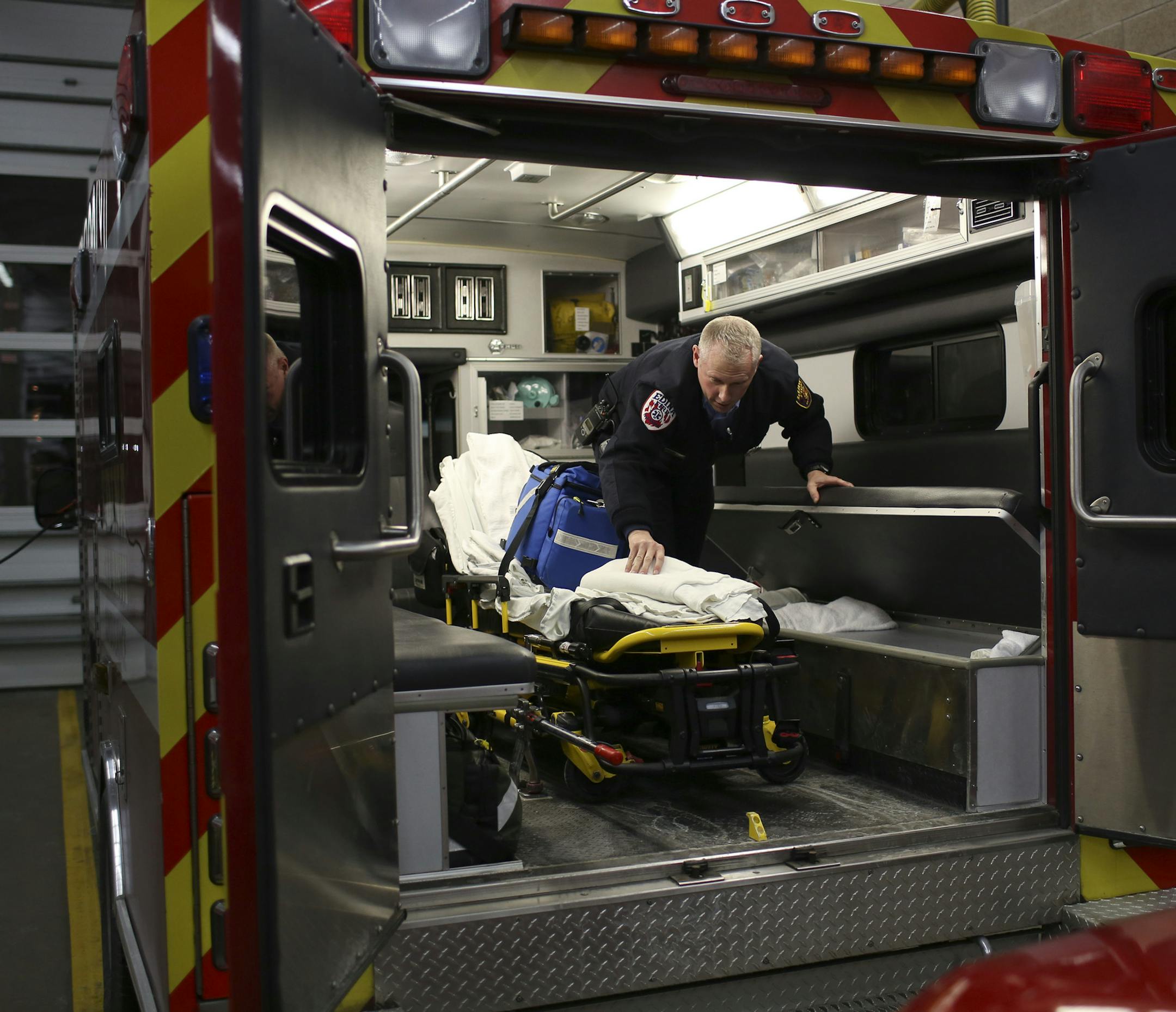 The challenge of running a local ambulance service has prompted some cities, including the consortium of Apple Valley, Lakeville and Farmington, to contract the service out to hospitals or health nonprofits. But cities like Edina, St. Paul and Burnsville remain committed to their ambulance services. Firefighter/Paramedic Mike Hughes went about replenishing supplies in an ambulance after returning to Station No. 1 following a run Thursday evening, January 2, 2014. ] JEFF WHEELER ‚Ä&#x
