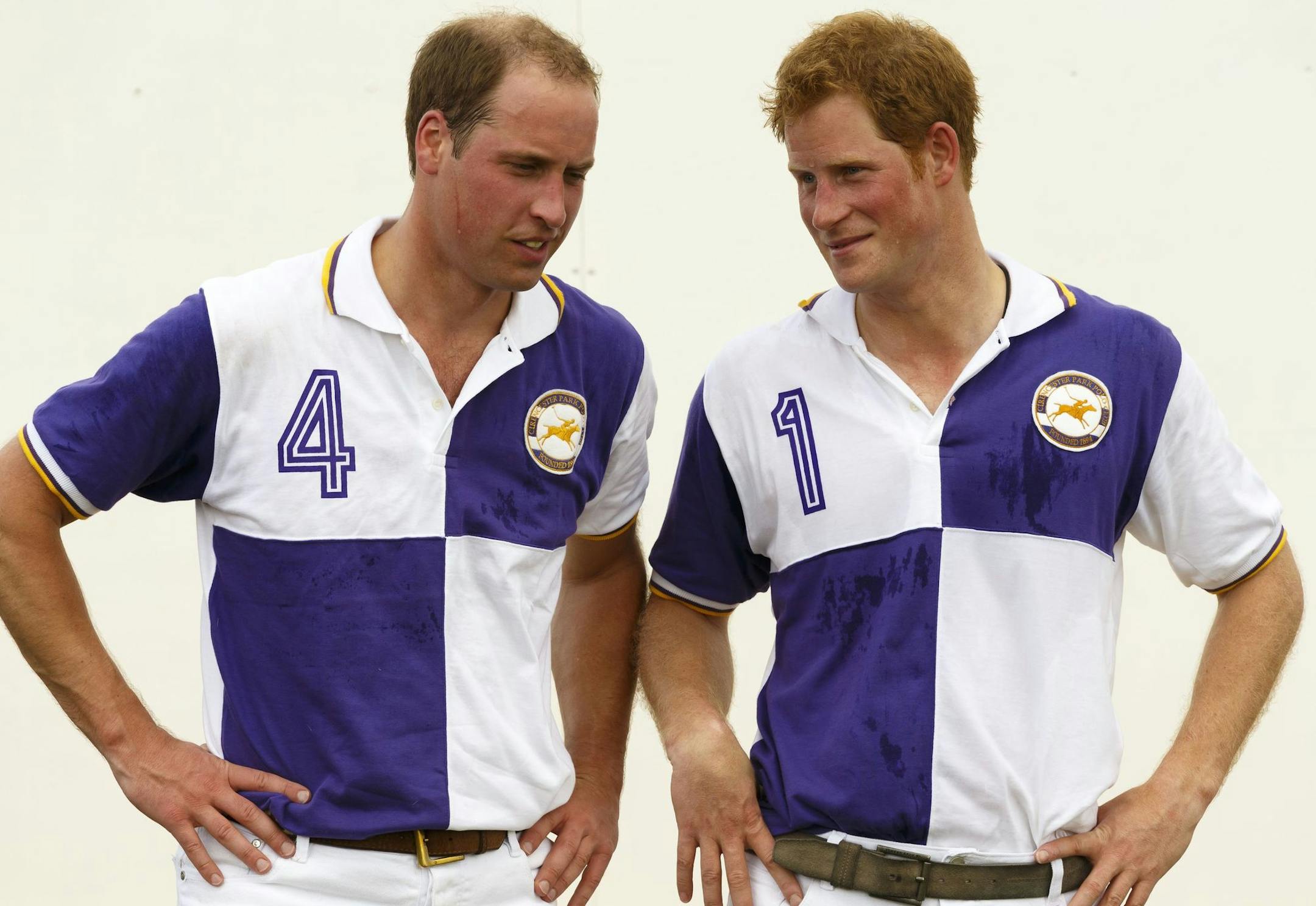 Prince William, the Duke of Cambridge, right, and Prince Harry chat after The Jerudong Trophy at Cirencester Park Polo Club in Gloucestershire Sunday July 14, 2013. Many in the British press have predicted that the first child of the prince and the Duchess of Cambridge, formerly known as Kate Middleton, was expected to arrive on Sunday but the prince was enjoying a game of polo against his brother Prince Harry at a charity event. (AP Photo/ Chris Ison, PA) UNITED KINGDOM OUT - NO SALES - NO ARCH