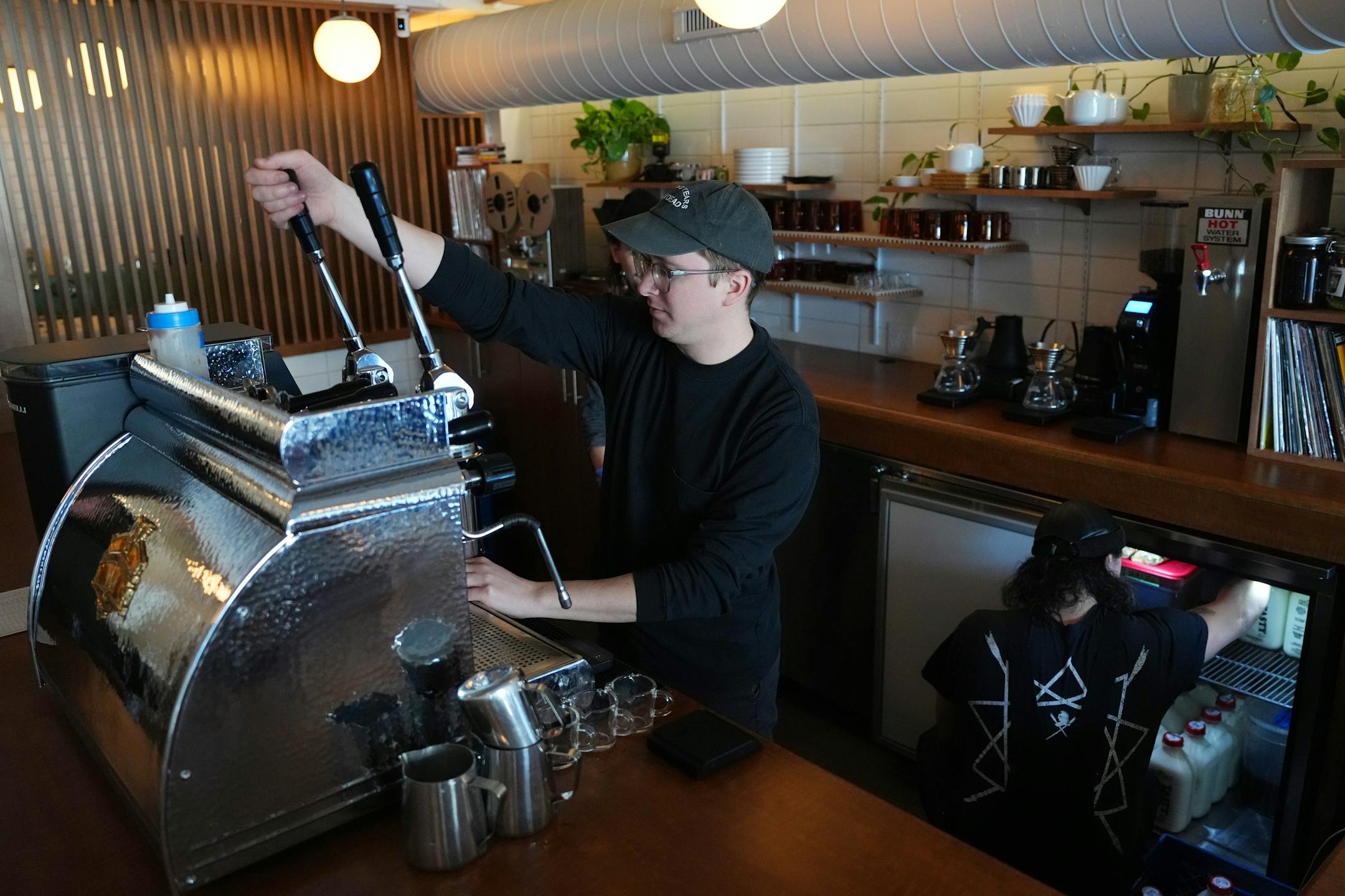 Owner Joel Eckerson makes a coffee at Disco Death Records.