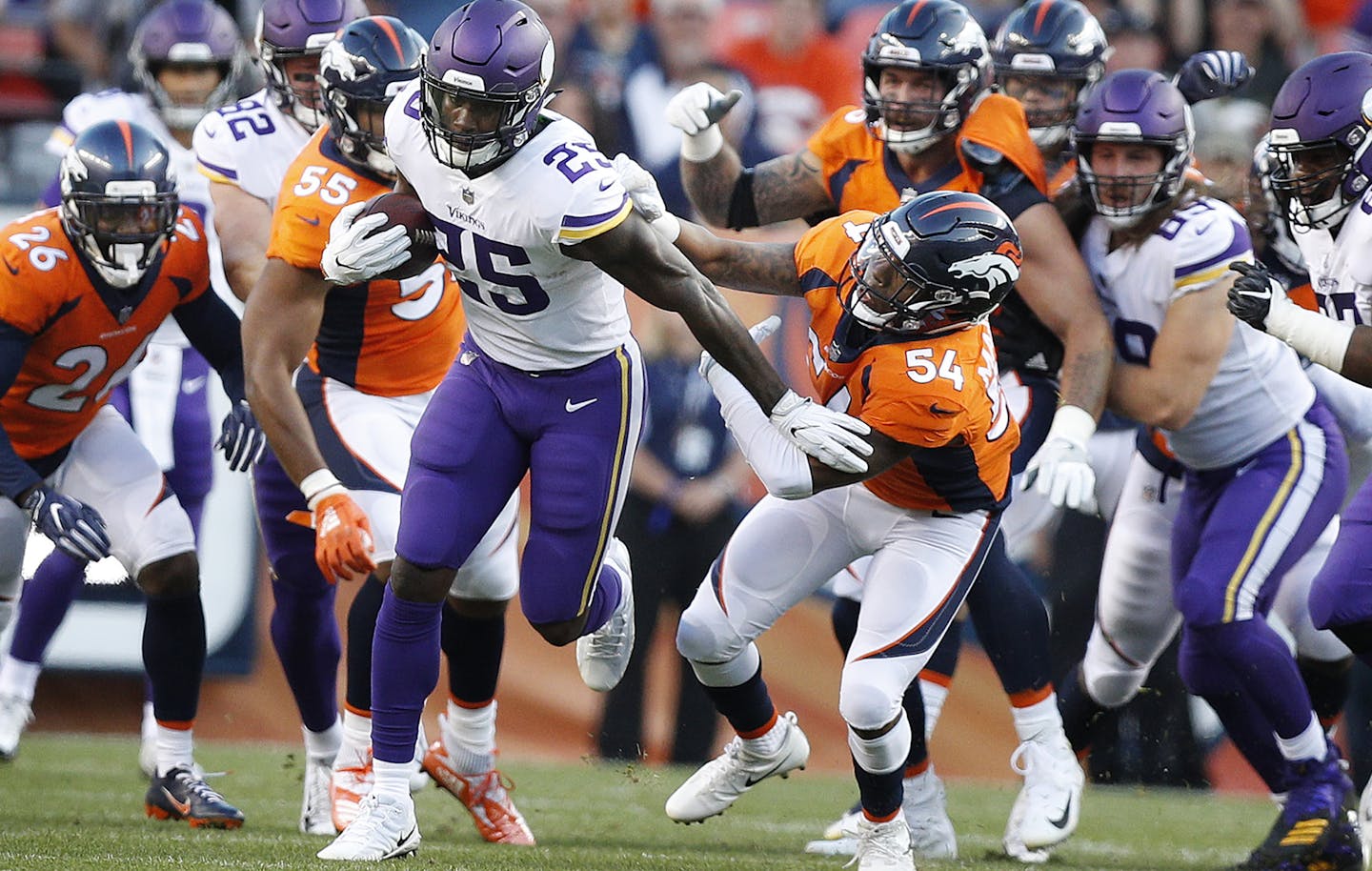 Minnesota Vikings running back Latavius Murray (25) broke the tackle of Denver Broncos linebacker Brandon Marshall (54) picking up 20 yards on the play Saturday August 11, 2018 at Broncos Stadium at Mile High in Denver, CO.] The Minnesota Vikings there first preseason game against the Denver Broncos at Broncos Stadium at Mile High . JERRY HOLT &#xef; jerry.holt@startribune.com