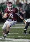 Minnesota Duluth quarterback Chase Vogler (18) looks for running room in the first half of the NCAA Div II College Football Championship game against 