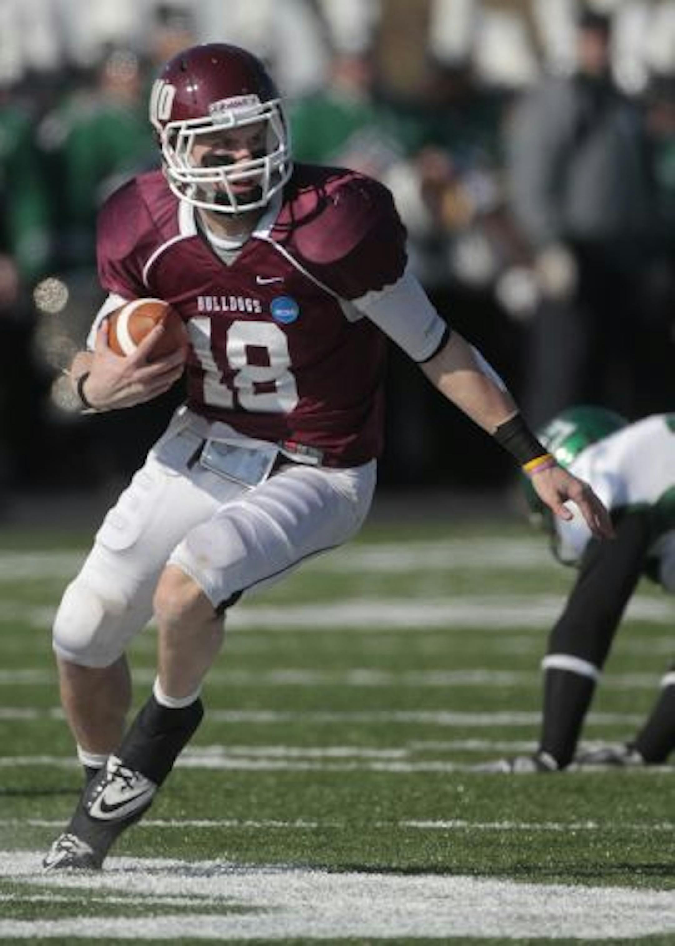 Minnesota Duluth quarterback Chase Vogler (18) looks for running room in the first half of the NCAA Div II College Football Championship game against Delta State at Braly Stadium in Florence, Ala., Saturday, Dec. 18, 2010.