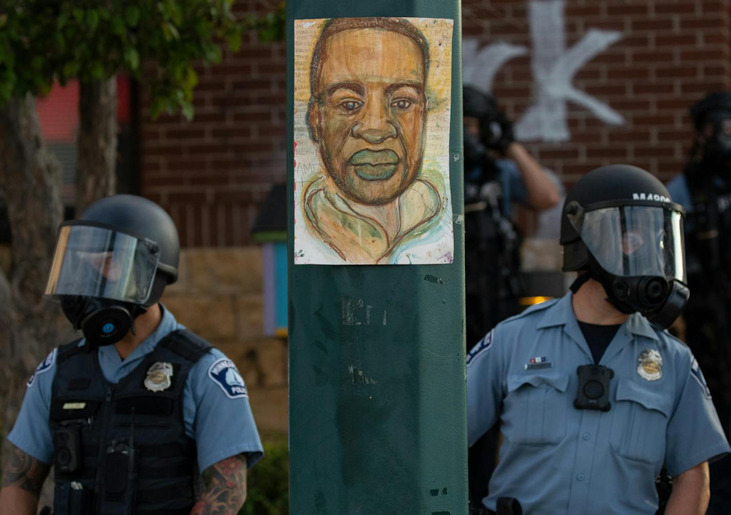 Police stood guard May 27 at the Third Precinct station. The station was burned down the next day during protesting and riots.