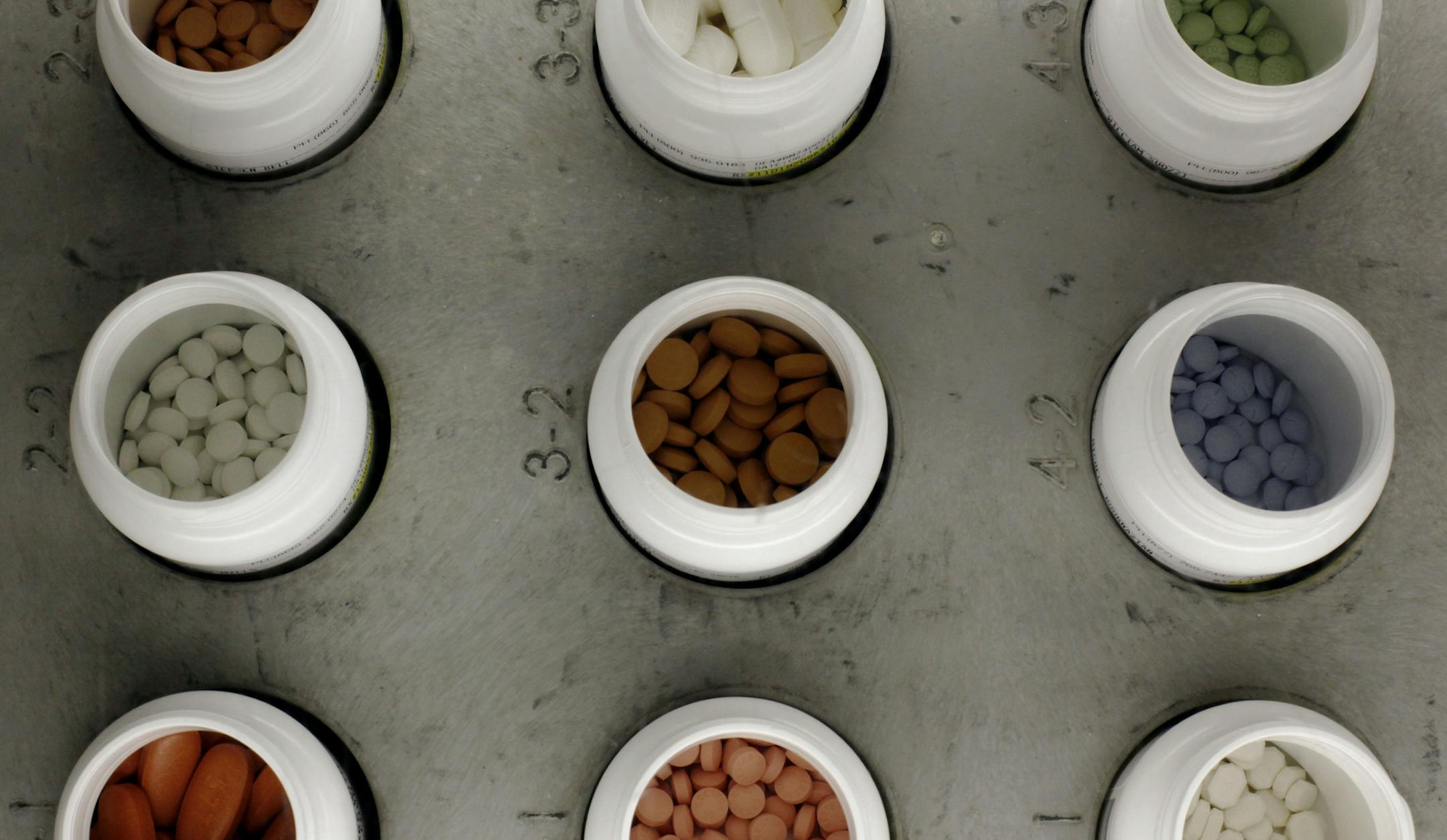 FILE - In this June 14, 2011 file photo, various prescription drugs on the automated pharmacy assembly line at Medco Health Solutions in Willingboro, N.J. Calling the rising cost of drugs “unsustainable,” congressional advisers Wednesday, June 15, 2016, recommended major changes to Medicare’s popular outpatient prescription program, now 10 years old. (AP Photo/Matt Rourke, File)