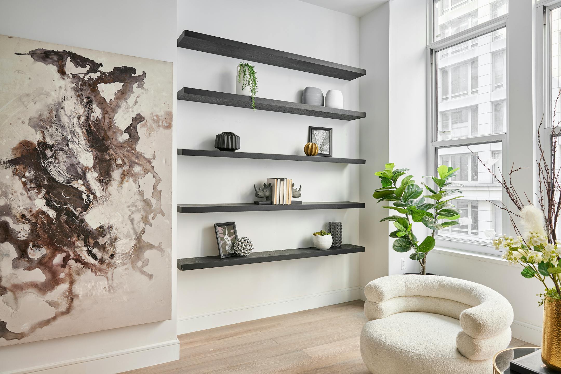 Wall shelving is used in lieu of cabinetry in this living space. (Handout/TNS)