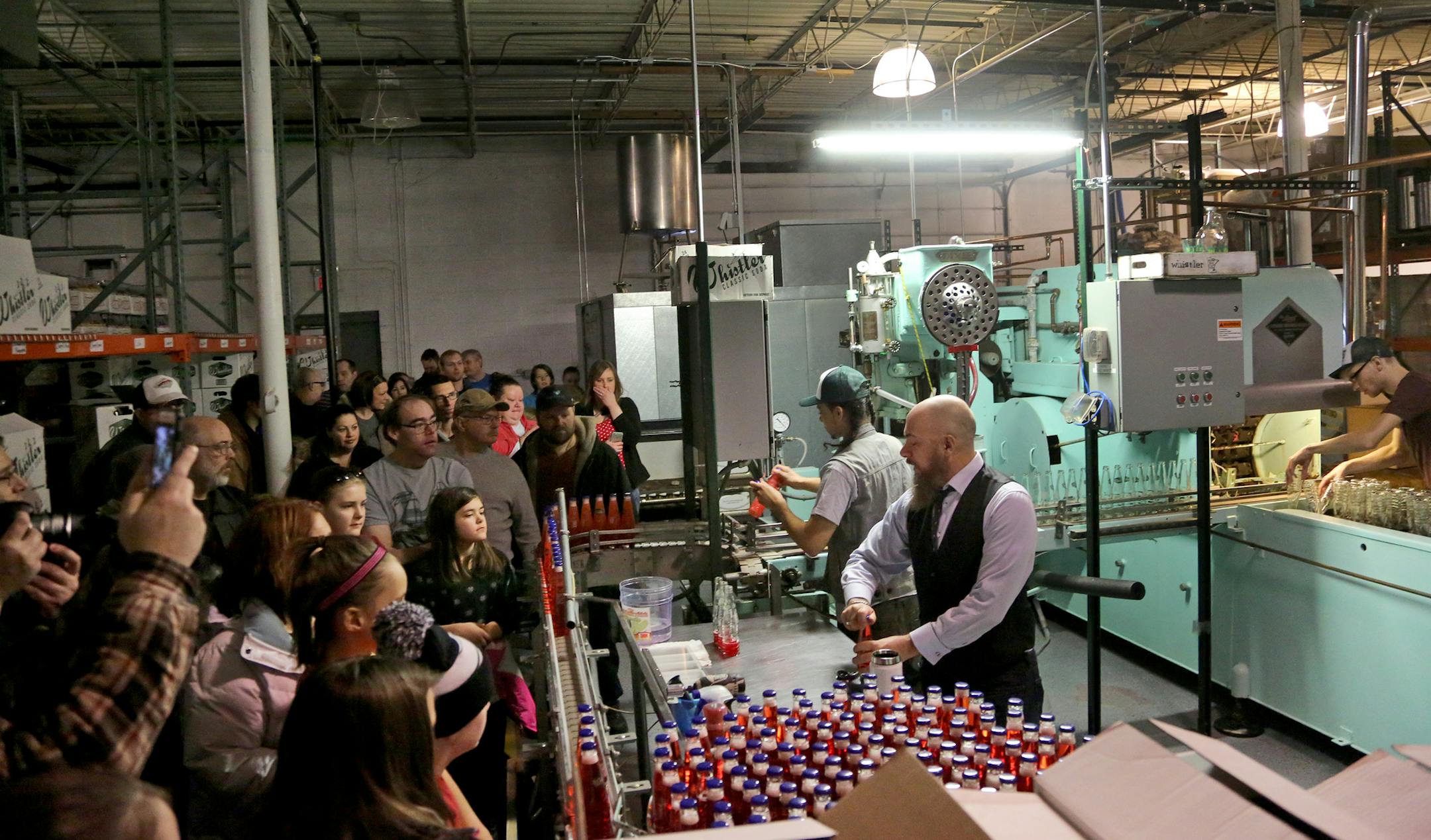 Blue Sun Soda Shop owner Mark Lazarchic, far right, showcased his baby blue, 1952 Dixie Bottler marchine during a tour on Feb. 4. &#x201c;I love how clunky it is,&#x201d; Lazarchic said of the bottler. &#x201c;Modern machines have no soul to them.&#x201d;