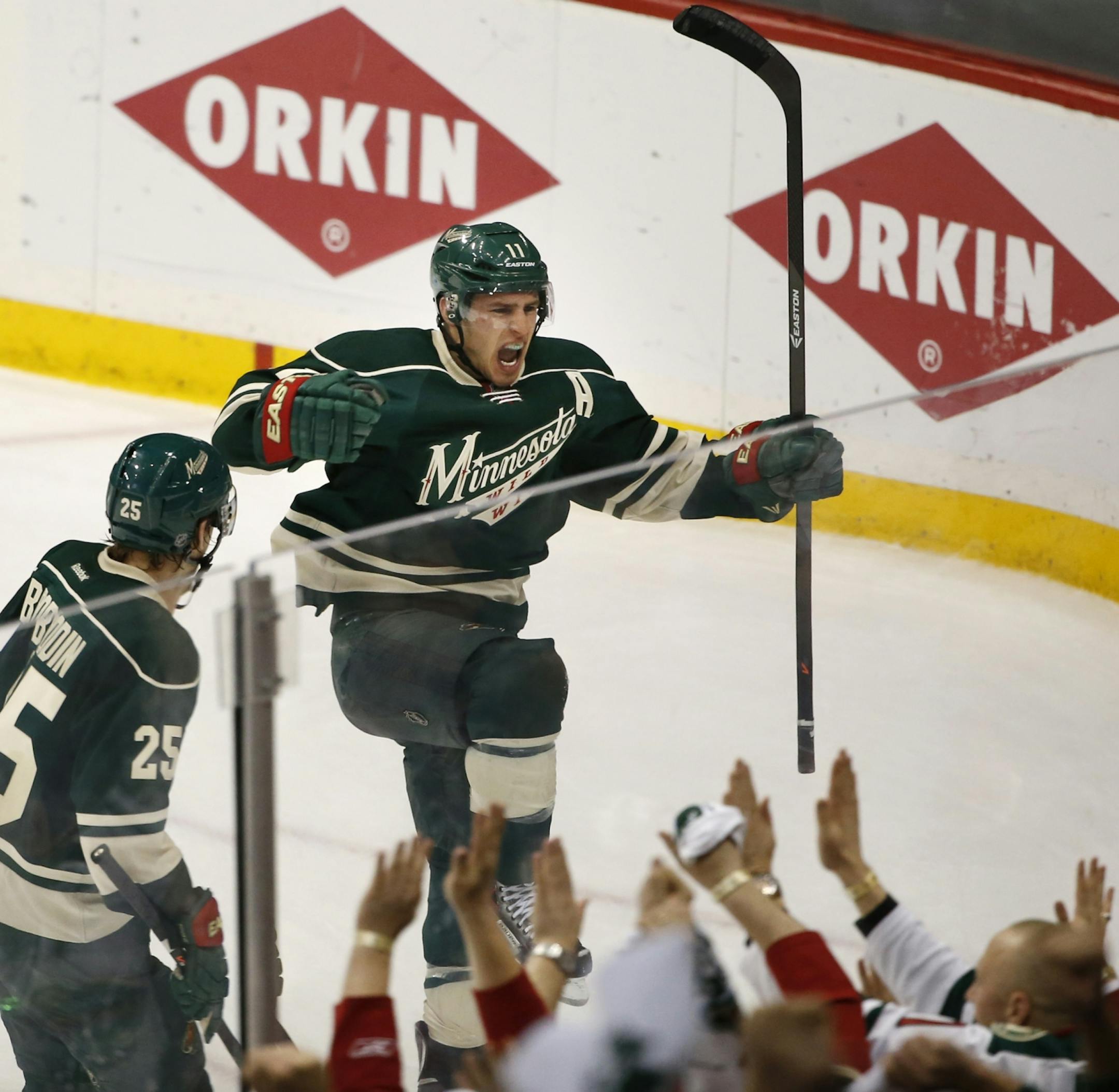 Wild left wing Zach Parise, right, celebrated his second goal of the night with defenseman Jonas Brodin (25), giving the Wild a 3-2 lead in the third period.