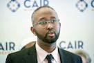 Surrounded by supporters, Jaylani Hussein, Executive Director, CAIR-MN announced a Minnesota-based report which he said detailed an anti-Muslim propag