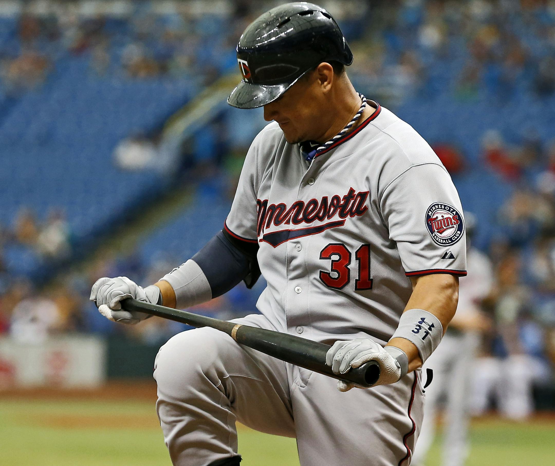 Oswaldo Arcia reacts after striking out during the ninth inning of a baseball game in July.