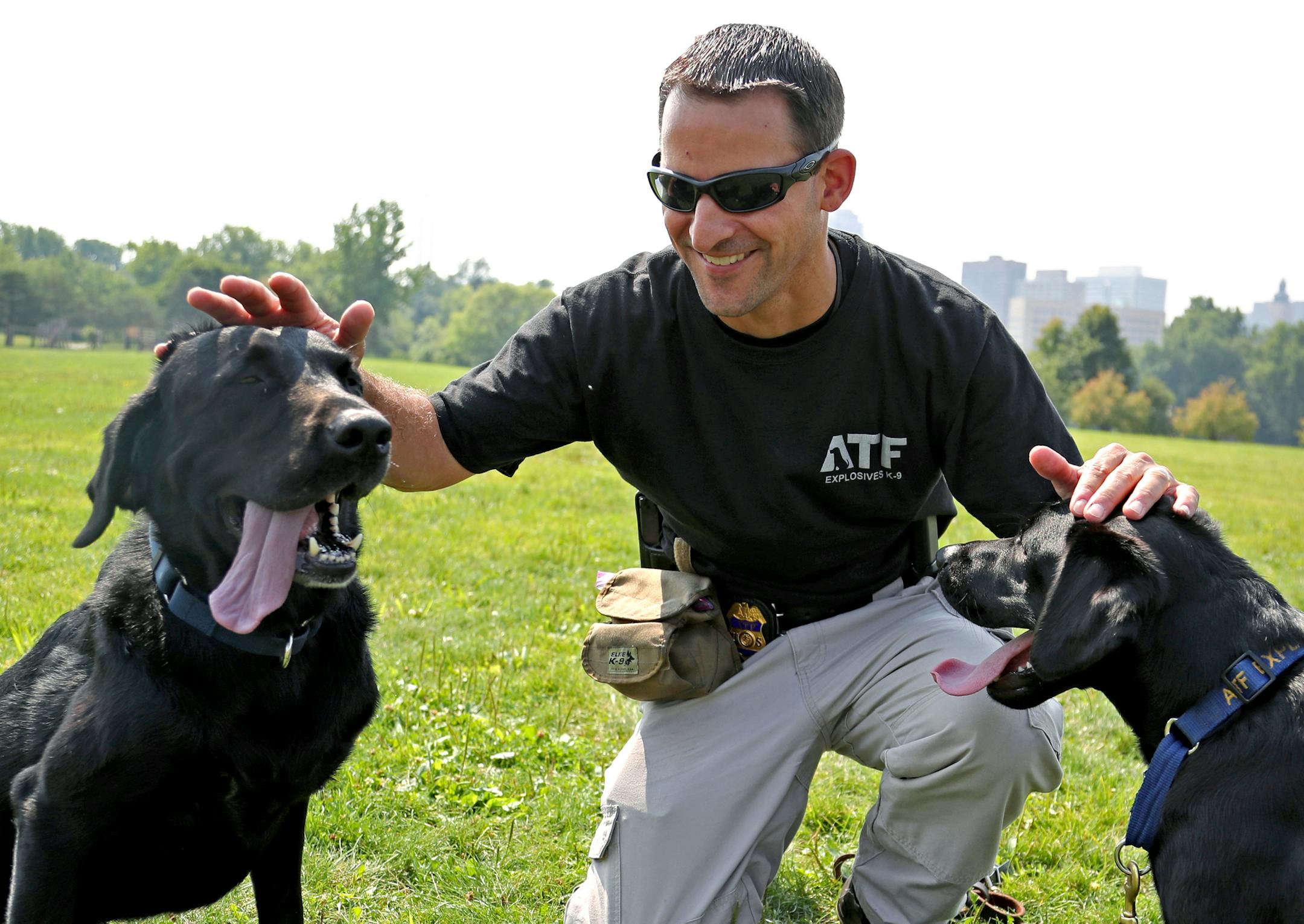 ATF agent Nic Garlie gave some love to his dogs Brock (left) and Taylor at the end of a training session. ] Shari L. Gross Ô shari.gross@startribune.com Nic Garlie, a veteran special agent K-9 handler with the ATF recently welcomed a new canine partner to the force after his longtime companion had to retire early because of behavioral complications. Garlie's new dog has a story of its own: the dog, Taylor, will be responsible for sniffing for evidence of explosives or shell casings at the s