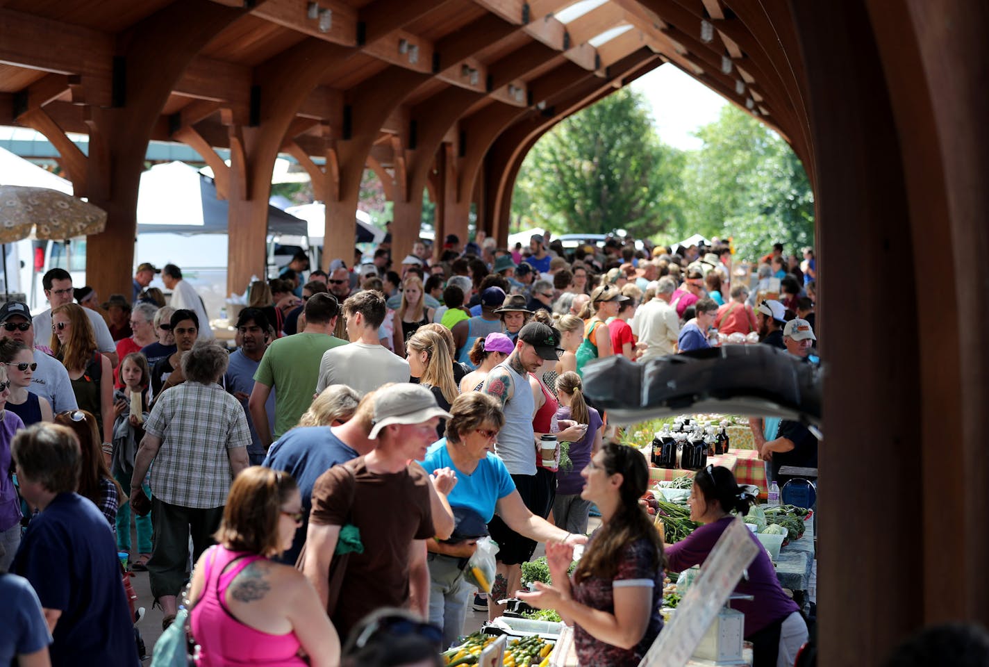 The Eau Claire Downtown Farmers Market is part of the city's revival of its downtown riverfront. Now, planners are hoping to for a passenger rail connection to St. Paul.