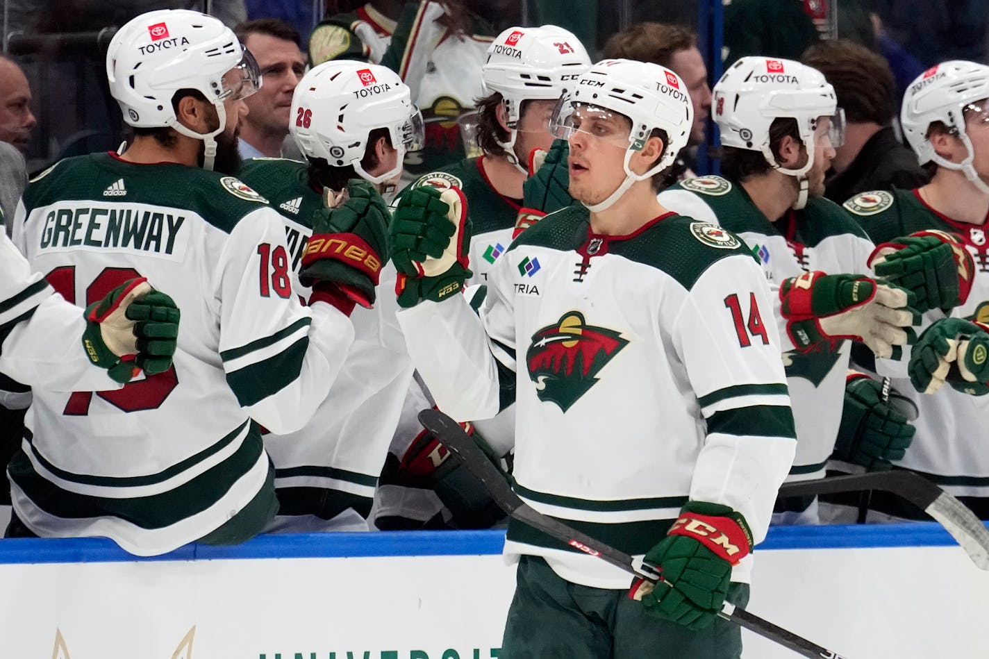 Minnesota Wild center Joel Eriksson Ek (14) celebrates with the bench after his goal against the Tampa Bay Lightning during the second period of an NHL hockey game Tuesday, Jan. 24, 2023, in Tampa, Fla. (AP Photo/Chris O'Meara)