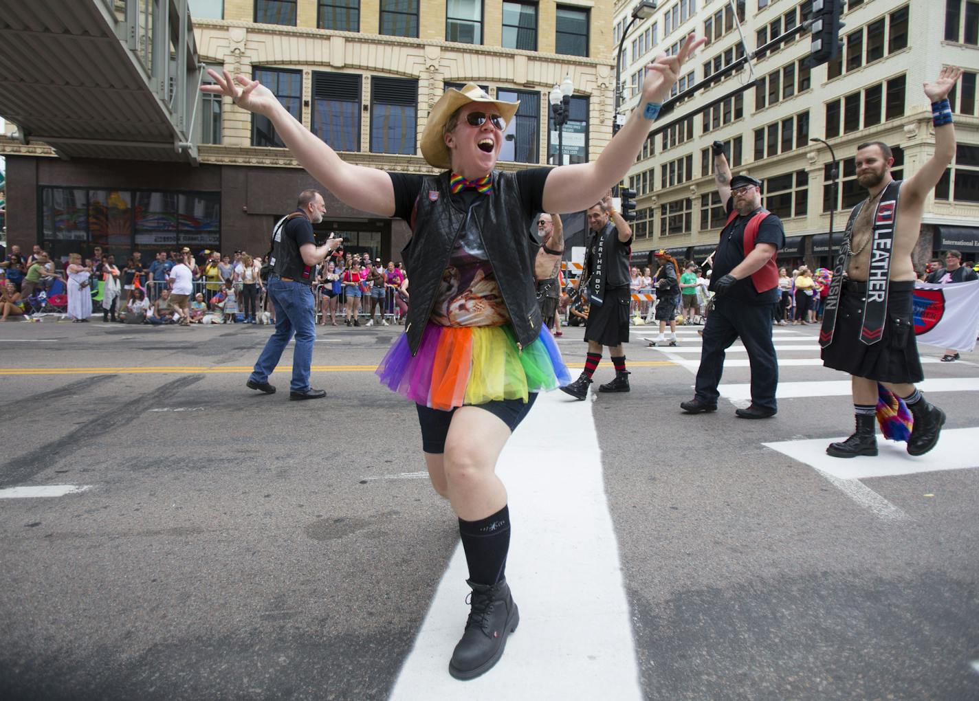 A parade marcher gets the crowd excited and cheering during the pride parade on Sunday. ] ALEX KORMANN &#x2022; alex.kormann@startribune.com Hundreds of thousands of people gathered on Hennepin Avenue for the annual Pride Parade on Sunday. People of all age, shapes and sizes lined the street to celebrate love and all it's forms. Dozens of local businesses and organizations marched in the parade, all showing support for the LGTBQ community.