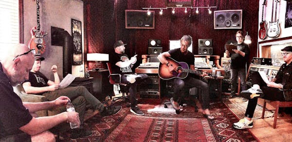 Tom Fugleberg (far left) and Brian Kroening (holding guitar) got together with collaborators at Drum Farm Studio in rural Menomonie, Wis.