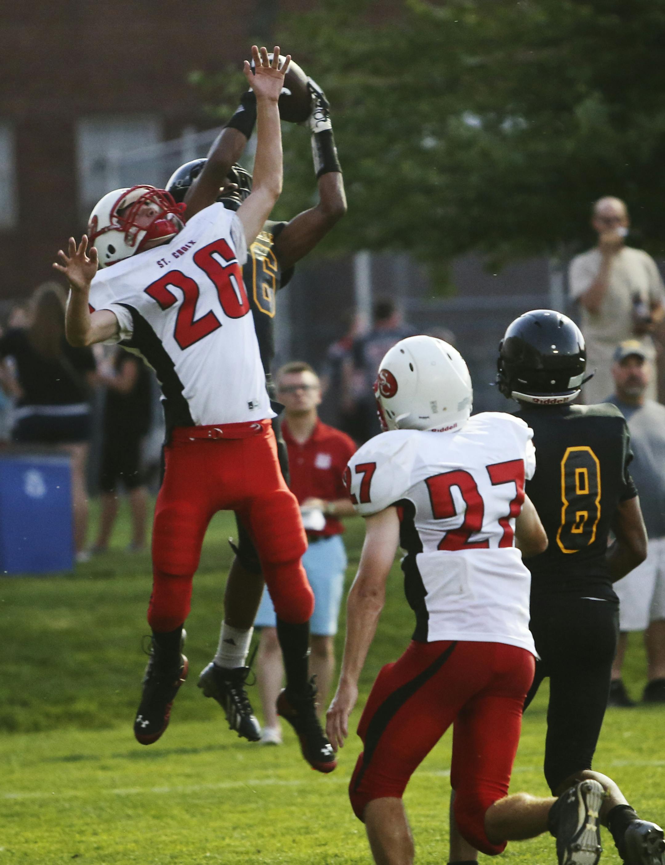 Under tight coverage by St. Croix Lutheran's Joshua Arndt (26) and as the first half expired, DeLaSalle receiver Isaac Hodge (16) hauls in a six yard TD pass from quarterback Billy Hart Friday, Aug. 30, 2013, at DeLaSalle High in Minneapolis, MN.](DAVID](DAVID JOLES/STARTRIBUNE) djoles@startribune.com High School football at St. Croix Lutheran at DeLaSalle High Friday, Aug. 30, 2013, in Minneapolis, MN.** Joshua Arndt, Isaac Hodge,cq