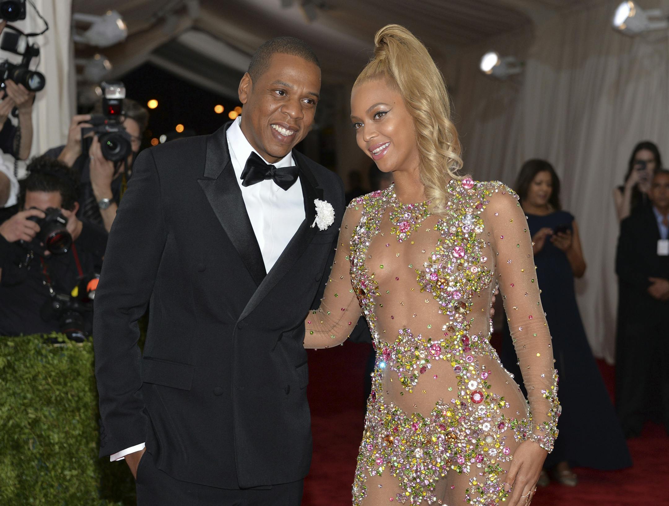 FILE- In this May 4, 2015, file photo, Jay Z, left, and Beyonce arrive at The Metropolitan Museum of Art's Costume Institute benefit gala celebrating "China: Through the Looking Glass" in New York. After bad weather forced concertgoers at the MetLife Stadium inside for close to an hour Thursday night, Aug. 2, 2018, Beyonce and Jay-Z hit the stage at 11:08 p.m. and played into Friday morning, wrapping the energetic show at 1:29 a.m. (Photo by Evan Agostini/Invision/AP, File)