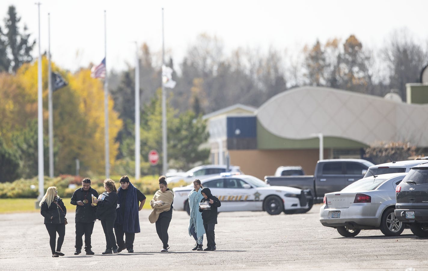 People walked away from the community center in Fond Du Lac after the lock down was lifted. The gymnasium inside is where a man was shot in the head only two hours earlier. ]
ALEX KORMANN &#x2022; alex.kormann@startribune.com A man was shot at a funeral in the Fond Du Lac Community Center gymnasium at approximately 9:46AM on Friday October 18, 2019. Schools, hospitals and tribal buildings were on lock down for over two hours.