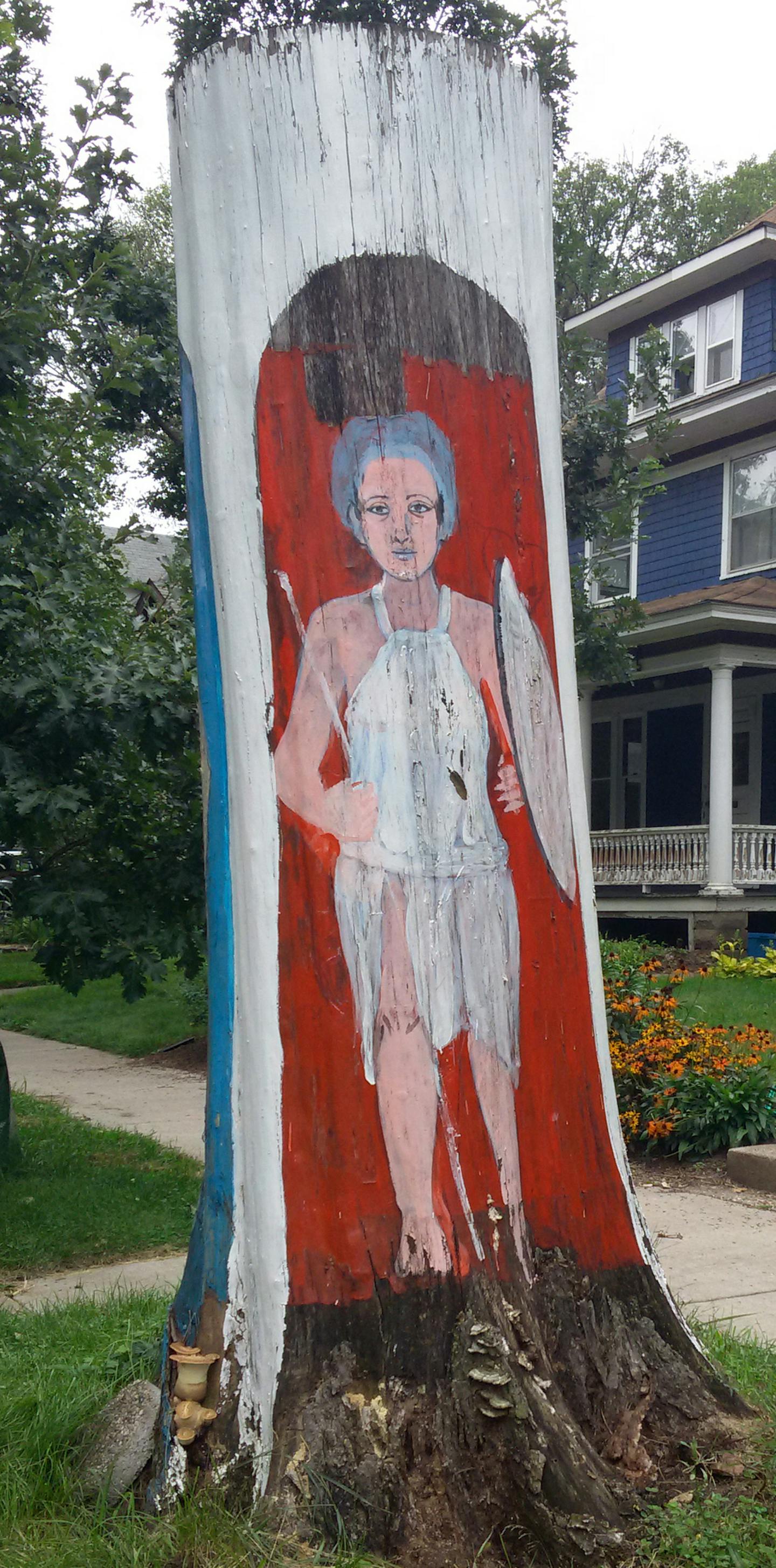 Hend Al-Mansour had three figures painted on the tree trunk that once stood in front of her home in the Union Park area of St. Paul, including one that upheld the Hand of Fatima to dispel the evil eye.]RichardTsong-Taatarii richard.tsong-taatarii@startribune.com