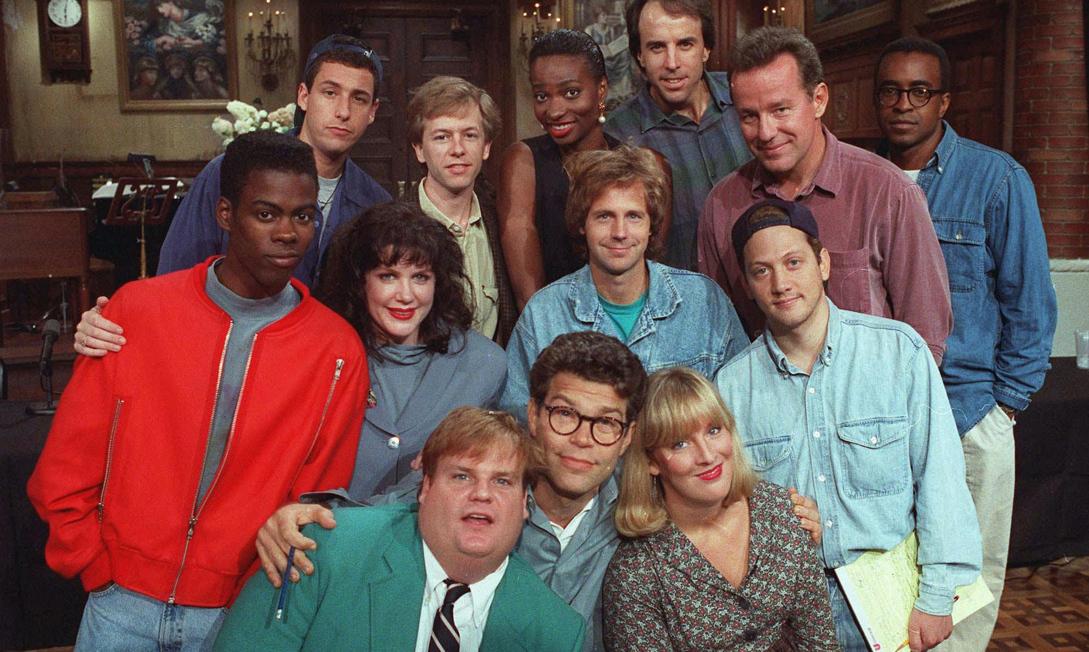 The cast of NBC's "Saturday Night Live" pose on the show's set in New York, Sept. 22, 1992. From left, front row, are: Chris Farley, Al Franken and Melanie Hutsell. In middle row, from left, are: Chris Rock, Julia Sweeney, Dana Carvey and Rob Schneider. In back row, from left, are: Adam Sandler, David Spade, Ellen Cleghorne, Kevin Nealon, Phil Hartman and Tim Meadows. (AP Photo/Justin Sutcliffe) ORG XMIT: APHS200,APHS200