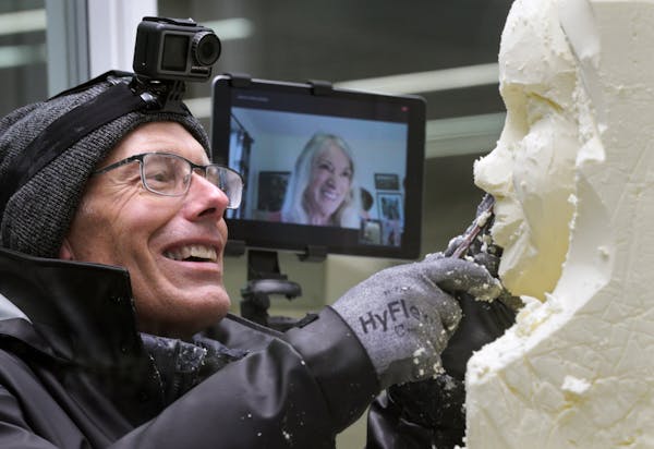 Longtime butter-princess sculptor Linda Christensen communicated via FaceTime to her apprentice, Gerry Kulzer, who was working on the butter sculpture