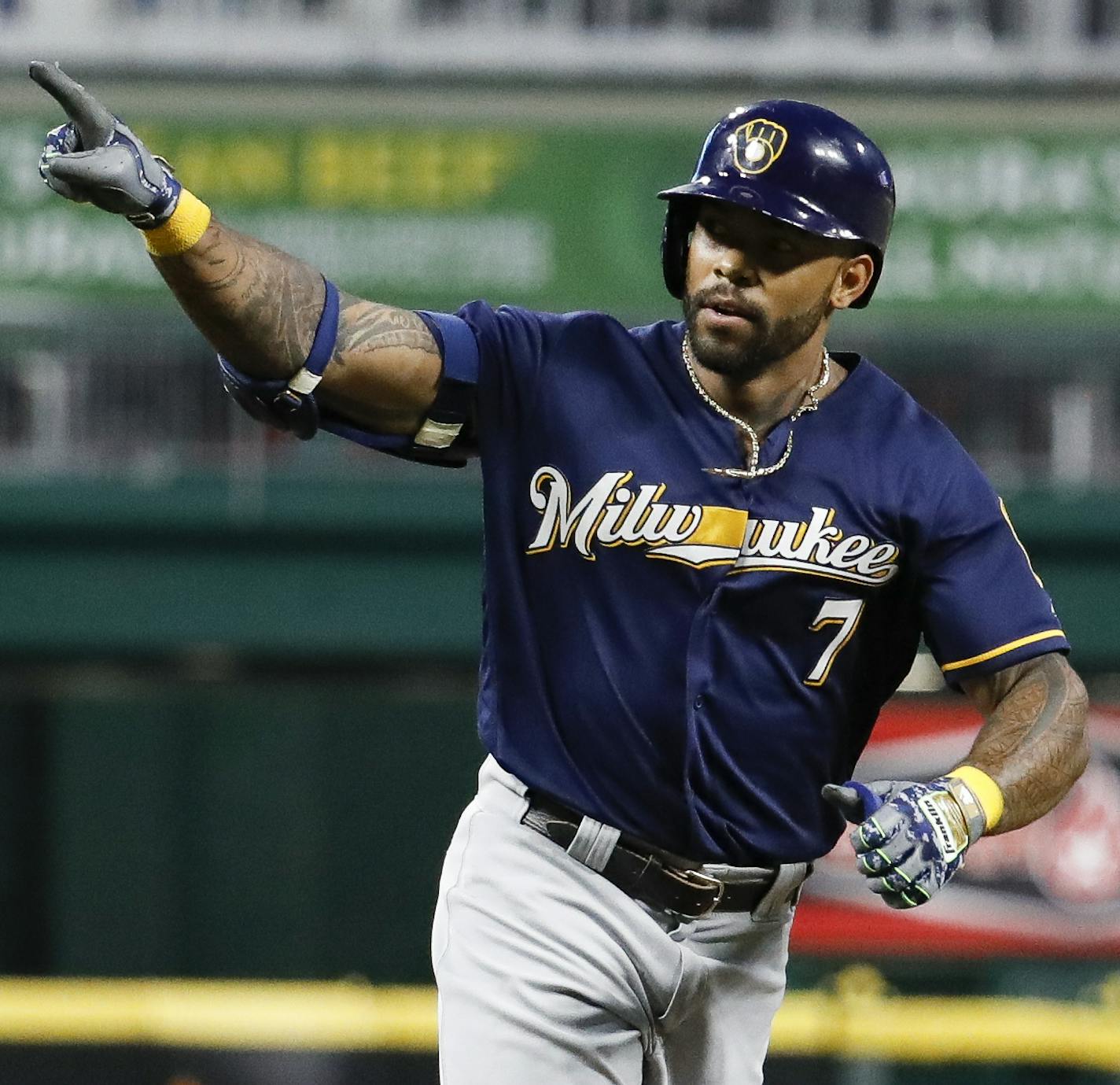 Milwaukee Brewers' Eric Thames runs the bases after hitting a three-run home run off Cincinnati Reds relief pitcher Amir Garrett in the seventh inning of a baseball game, Thursday, June 28, 2018, in Cincinnati. (AP Photo/John Minchillo)