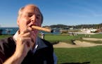 In this Feb. 3, 2001, file photo, Rush Limbaugh puffed on his Ashton VSG cigar while waiting to tee off from the fifth tee of the Pebble Beach Golf Li