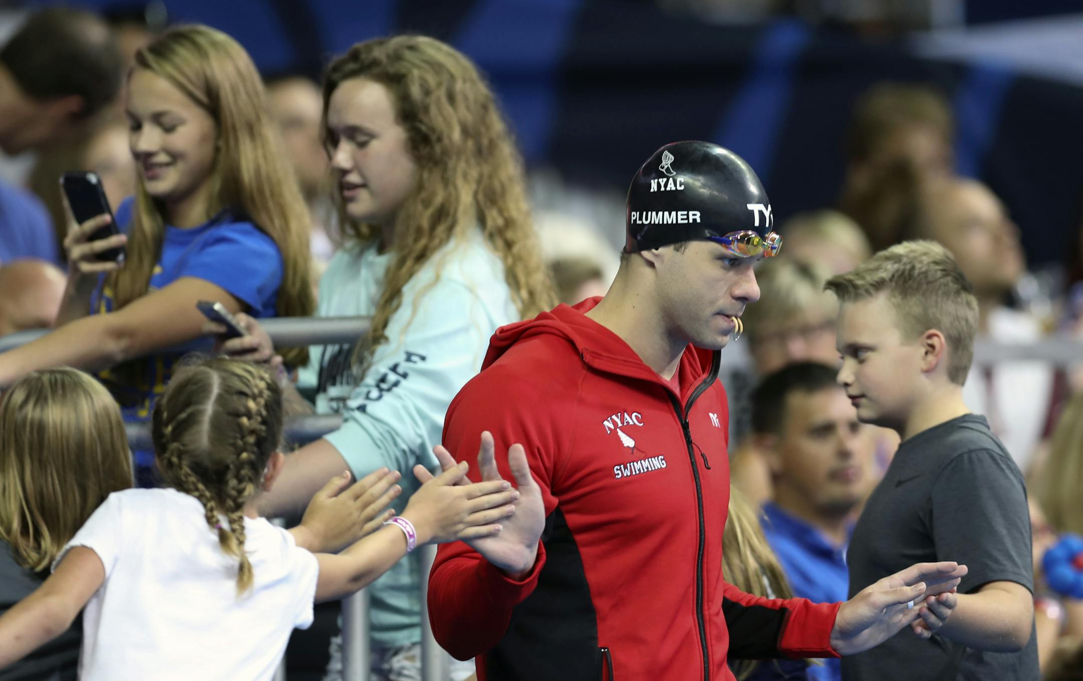 DAY 3 of the 2016 U.S. Olympic Swimming Trials- The former Gopher David Plummer swam the 100-meter backstroke in 52.28 seconds in Tuesdayís finals at the U.S. Olympic trials to earn a spot in next monthís games. He was second behind Ryan Murphyís 52.26. Here, Plummer was in the zone as he walked through the fans before the race. ] 2016 U.S. Olympic Swimming Team Trials brian.peterson@startribune.com Omaha, NE - 06/28/2016
