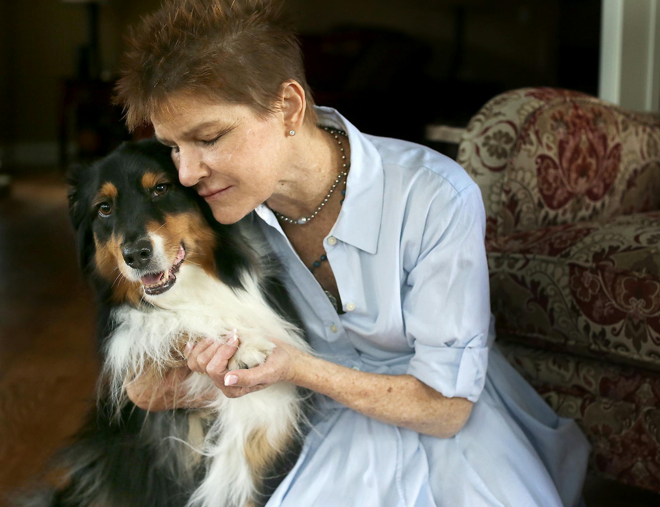 Shelli Stanger received love from her dog Lindy at her home, Monday, August 8, 2016 in Bloomington, MN. Stranger has been blind since age 24, a result of severe diabetes. Other health problems have plagued her. But she went on to become a registered nurse, head of a department at Fariview Hospital, and now has moved on to a counseling model helping people in trauma realize that their stories hold the key to improving their lives. ] (ELIZABETH FLORES/STAR TRIBUNE) ELIZABETH FLORES • eflore